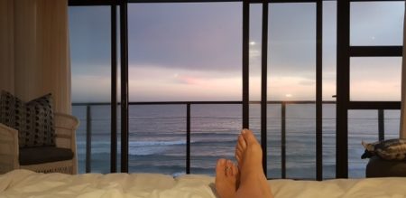 Relaxing in the bedroom with ocean view from Azure Wilderness Villa